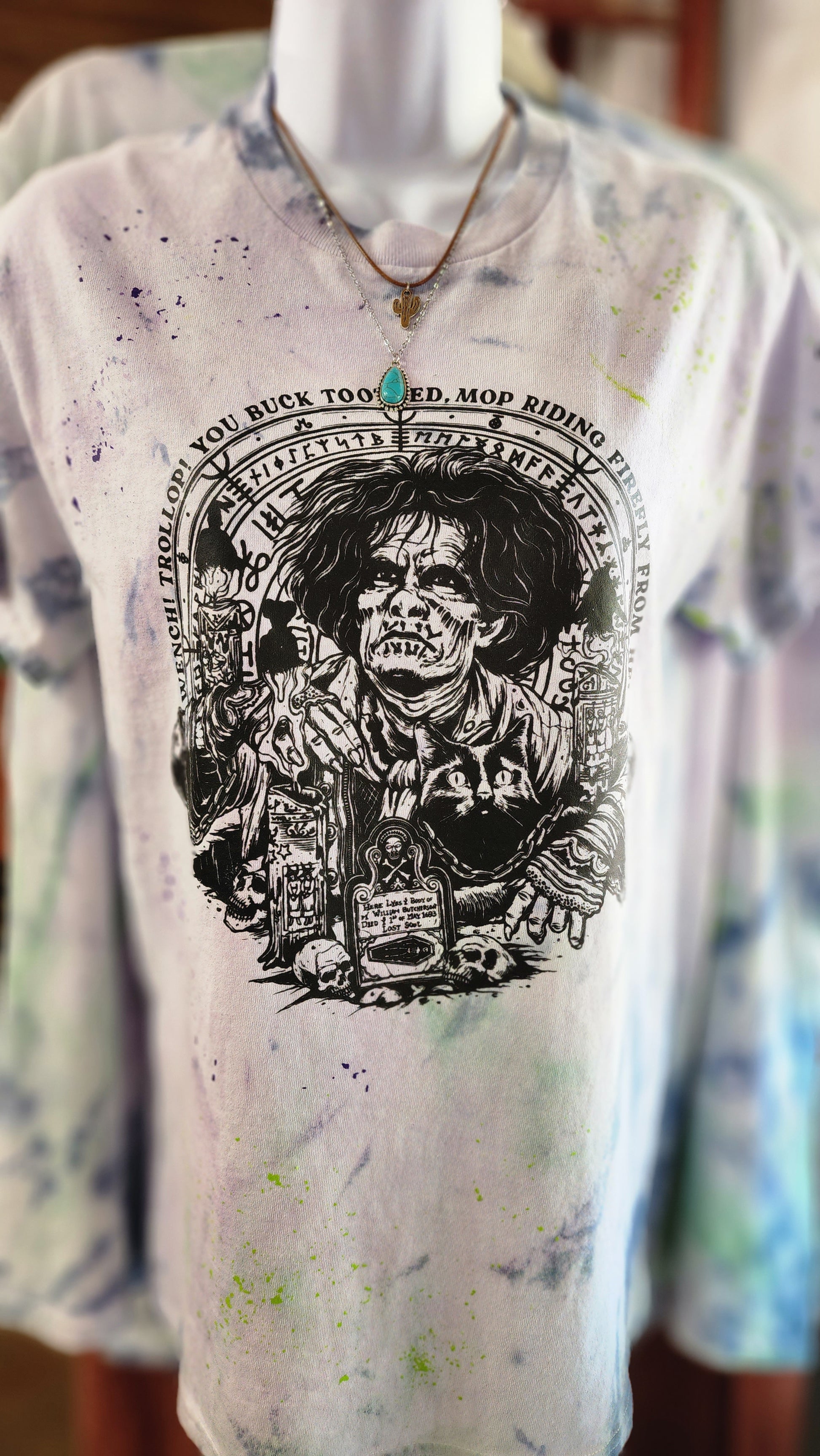 Tie dye tee with tie dye colors of lime green and purple. Image is in black and is of characters from Hocus Pocus. The Zombie is the main character 