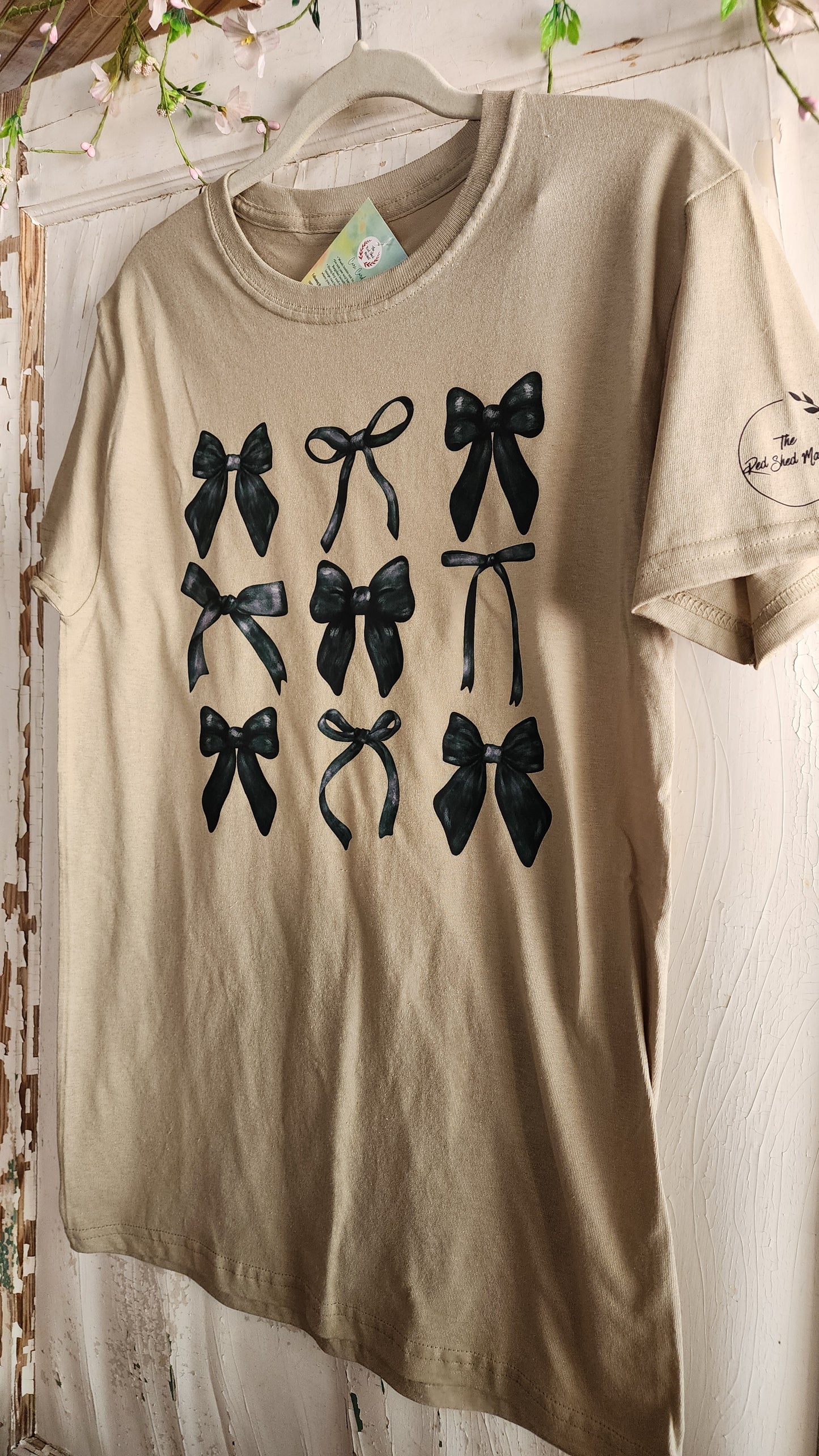 Croquet Bows In Black On Light Weight Tan Tee