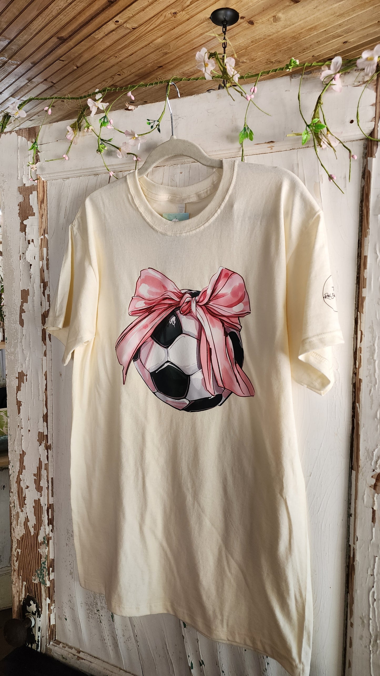 Soccer Ball with Large Oversized Pink Bow Design On Cream Tee